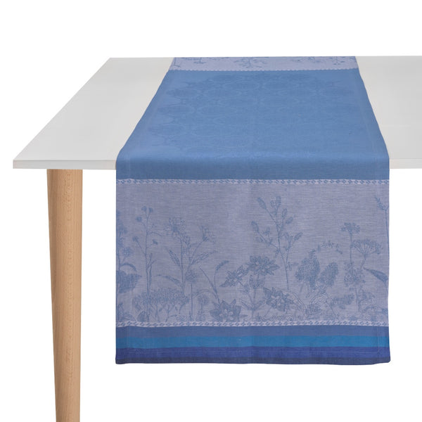 table runner in blue with floral pattern laid on table