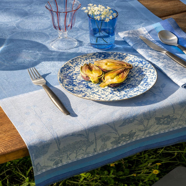 blue pattern table runner with a plate with cut artichokes