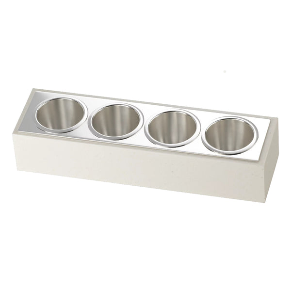 A silver-plated sugar bar with four compartments, each holding silver inserts, against a cream-colored background.