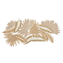 A table runner with a leaf pattern featuring natural, gold, and silver colored beads, displayed on a white background.