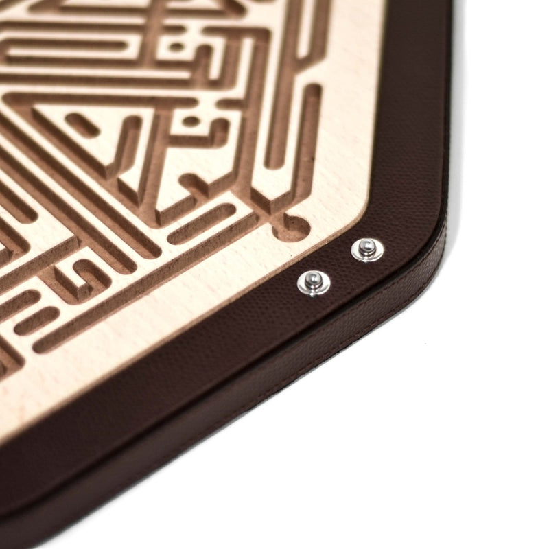 Close-up of a Luxury Jinn Octagonal Labyrinth in brown grained leather with veneered beech fibre panel by Pinetti