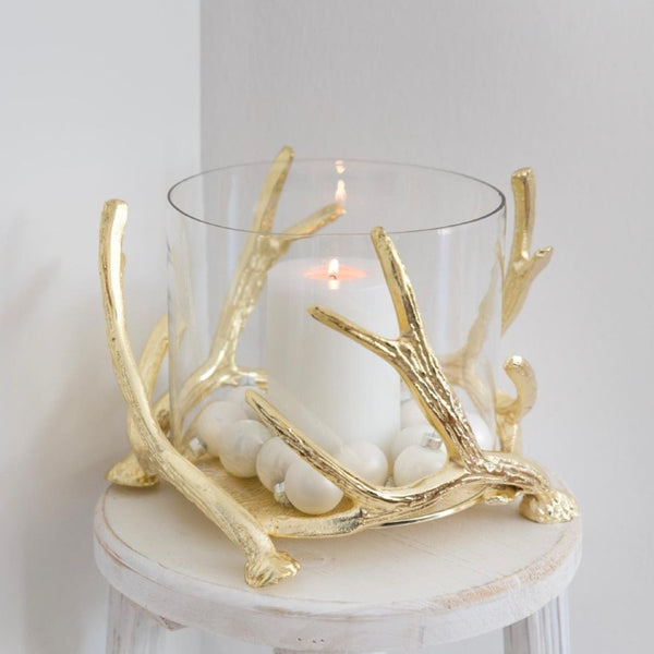 styled side table with Kingston hurricane candle holder by Edzard with gold antlers and glass cylinder, height 20 cm