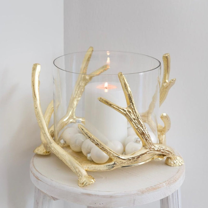 styled side table with Kingston hurricane candle holder by Edzard with gold antlers and glass cylinder, height 20 cm