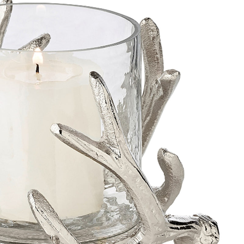 close-up of the Kingston hurricane candle holder by Edzard with steel deer antlers and clear glass bowl