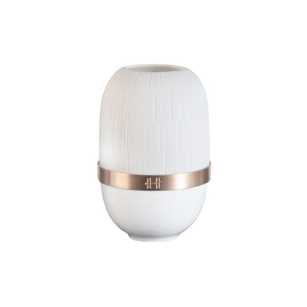 White candle holder with a bronze band on a white background