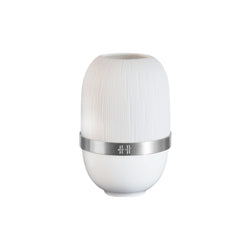 White cylindrical candle holder in porcelain with silver band on a white background