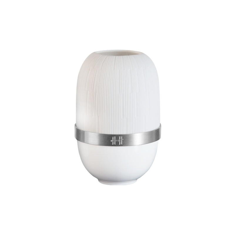 White cylindrical candle holder in porcelain with silver band on a white background