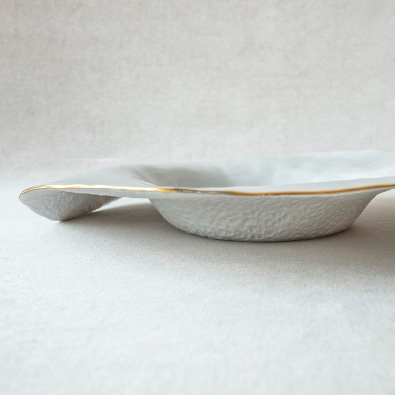 Set of 2 large deep plates white with golden rim No7 Indulge porcelain on a light gray background