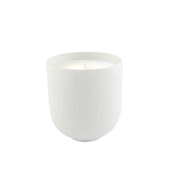 White textured ceramic candle pot on a white background