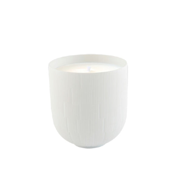White textured ceramic candle pot on a white background