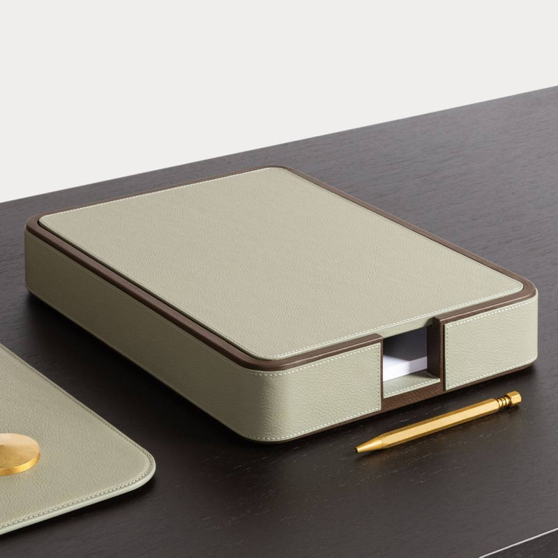 Giobagnara x Poltrona Frau A4 leather paper tray with lid in Pelle Frau with a pen on a dark surface