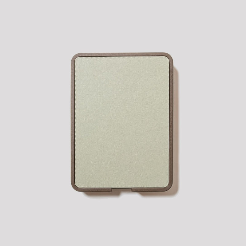 Top view of the Giobagnara x Poltrona Frau A4 leather paper tray with lid in Pelle Frau on a light gray background