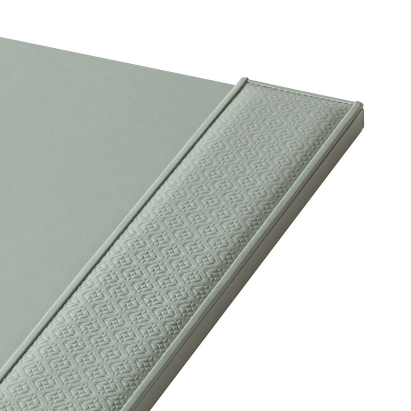 Close-up of Giobagnara x Elie Saab leather desk blotter with padded monogram inserts