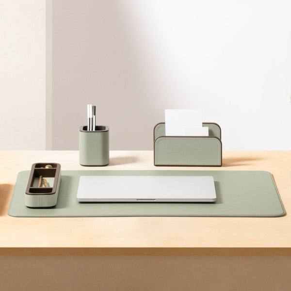 Desk organizer set with a pen holder, paper towel holder, and tray on a wooden surface.