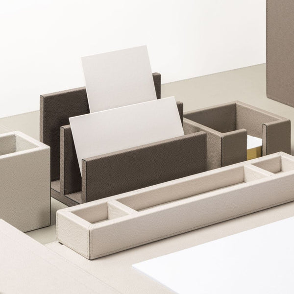 Beige and brown desk organizer with compartments on a white background