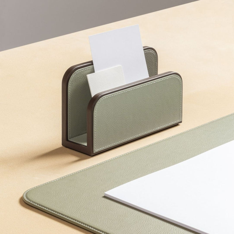 Leather Envelope Holder in Pelle Frau leather by Giobagnara x Poltrona Frau with a pen holder and paper on a beige surface