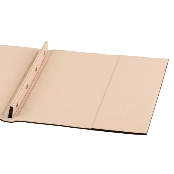 Close-up of Giobagnara A4 leather folder open flat, showing dual inner pockets and central four-screw system