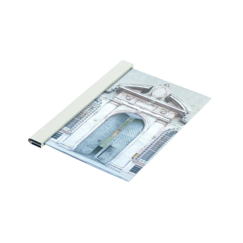 White Giobagnara leather magnetic sheets holder gripping a magazine with strong inner magnetic clasp