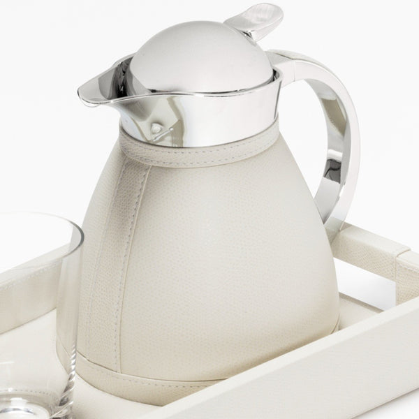 Close-up Leather tray set Beaubourg with Chantilly 0.6L carafe and one glass by Pigment France.