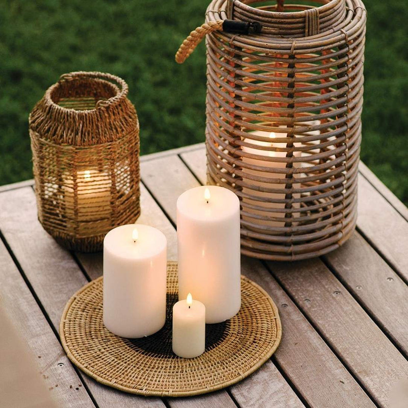 styled outdoor table with LED pillar candle 15cm in Ivory by Uyuni Lighting