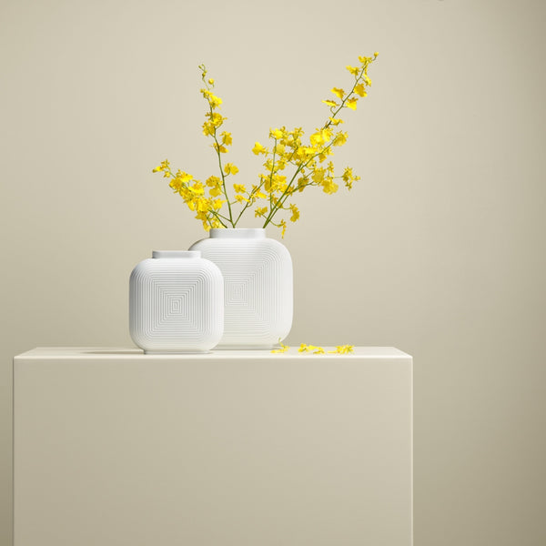styled Linda white vases by Sieger Furstenberg with yellow flowers
