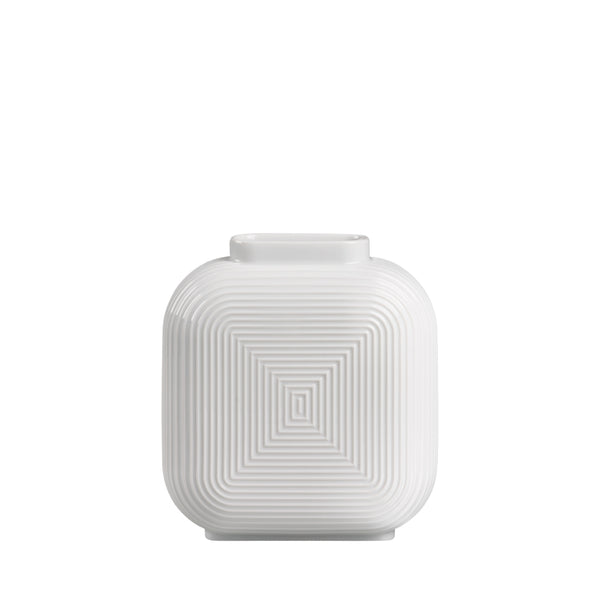 A white, geometric patterned porcelain vase with a modern design.