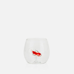 Clear glass tumbler with a red fish design on a white background