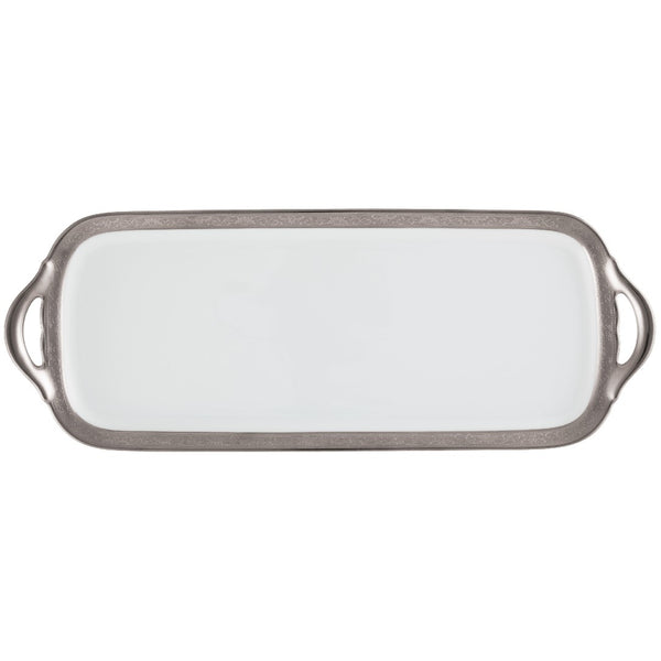 A long cake serving plate with a renaissance style border in platinum and gold, designed by Raynaud.