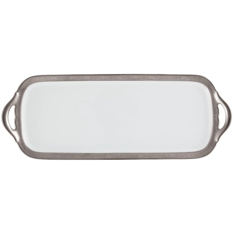 A long cake serving plate with a renaissance style border in platinum and gold, designed by Raynaud.