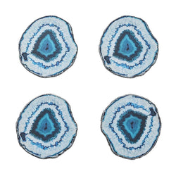 Four blue and white agate slice coasters on a white background
