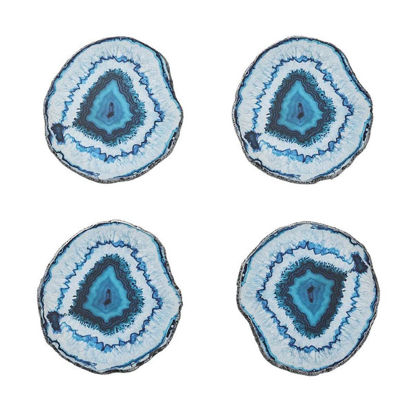 Four blue and white agate slice coasters on a white background