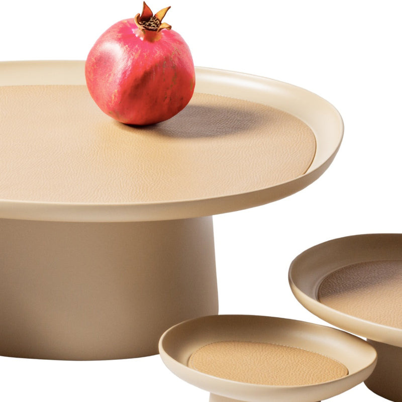 3 different sizes of 'Maris' Stackable Tray by Kelly Wearstler with a pomegranate on top