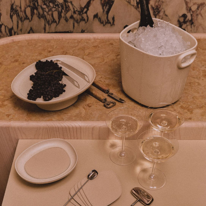 Styled bar counter with Maris champagne bucket for 1 in cast aluminium by Kelly Wearstler x Giobagnara, ivory finish