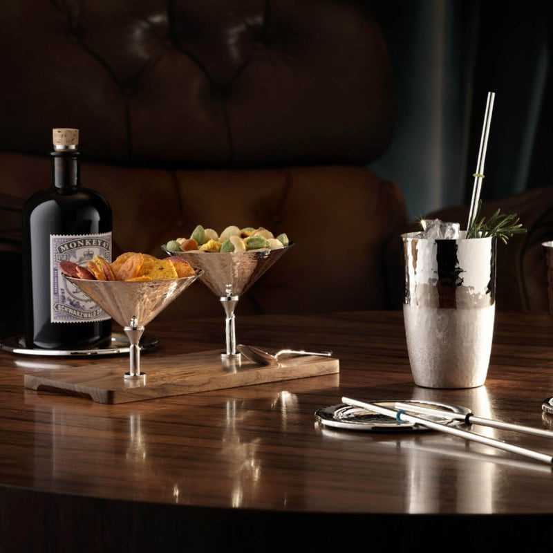 Bottle of Gosling's Dark Rum with cocktail shaker and Silver-plated Martelé snackbar with two hammered bowls on a walnut base by Robbe & Berking