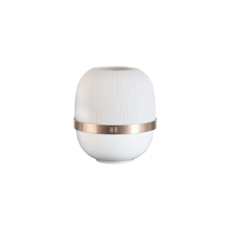 White candle holder with a rose gold band on a white background