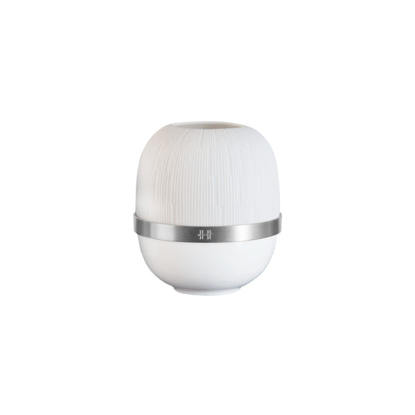 White cylindrical candle holder with a silver band on a white background