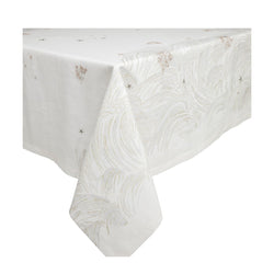 A white linen tablecloth with a large-scale embroidered design featuring coral branches, pearls, and starfish, and embroidery in beige and white gold thread.