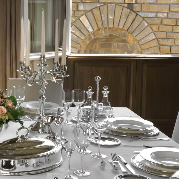 Dining table set with silverware, glassware, Oil and Vinegar Oval Cruet Stand La Perle Royale Silver-Plated by Greggio, in a formal setting.