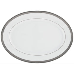 An oval-shaped serving platter with a white porcelain surface and a platinum and gold inlaid border.