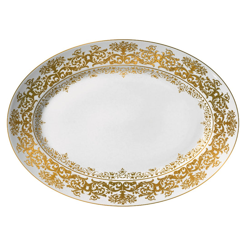 An oval white porcelain platter with gold accents and floral motifs along the rim.