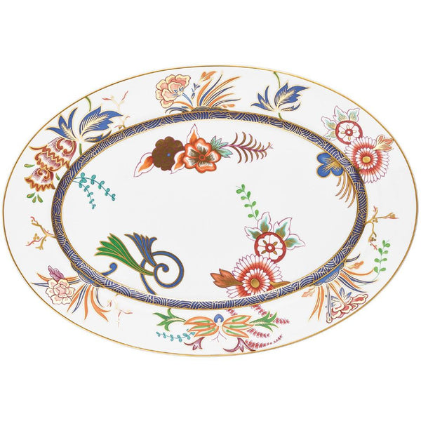 Oval porcelain platter with floral Imari motif, cobalt blue border, and gold rim by Raynaud