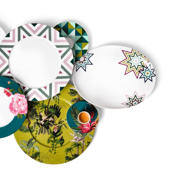 Set of colorful plates and platters Paraiso with geometric and floral designs on a white background