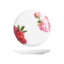 Round white object with pink floral design on a white background