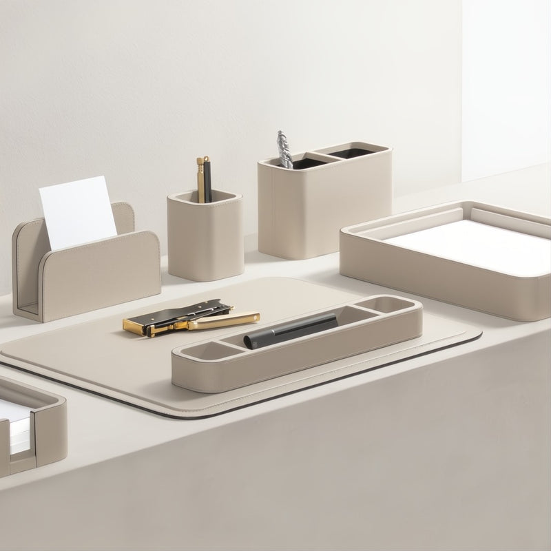 Ivory office desk organizer set with various compartments on a light gray surface.