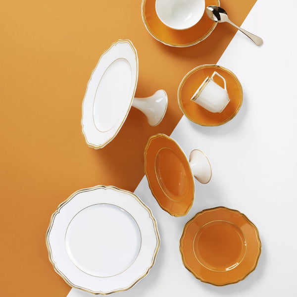 styled Mazurka White & Gold petit four and cake stand 16cm by Raynaud in Limoges porcelain with golden festoons inspired by the Polka collection.