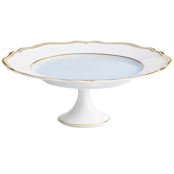 A blue and white porcelain cake stand with gold accents and a scalloped edge, featuring a smooth and shiny surface.