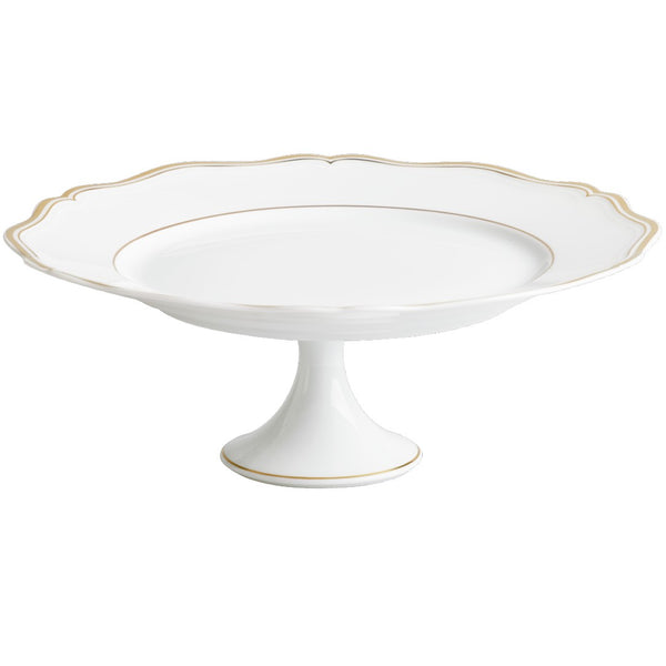 A white porcelain cake stand with gold accents around the rim and base.