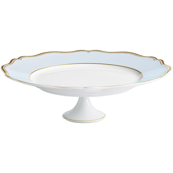 A porcelain cake stand with blue grey color and gold trim, featuring a scalloped edge design.