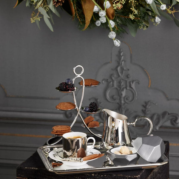 Tea set with cookies and Silver-plated Petit Fours Latitude stand with six small dishes by Ercuis, ideal for serving macarons, petits fours, or desserts in a luxury setting.