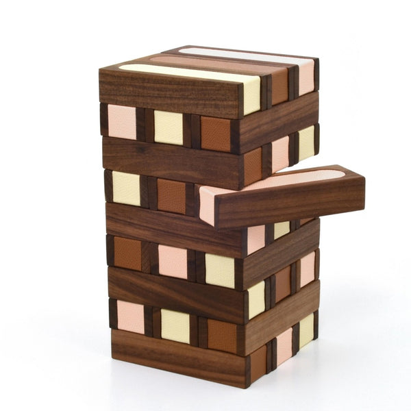 Wooden block tower puzzle with multicolored blocks on a white background